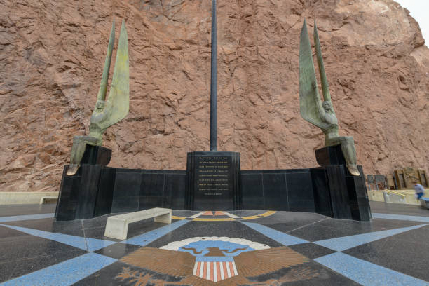Four corners national park where the four corners of Utah, Arizona, Colorado and New Mexico meet in the desert. People waiting for their turn to stand on all four states at once.
