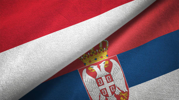 istock Serbia and Indonesia two flags together textile cloth fabric texture 1093214744