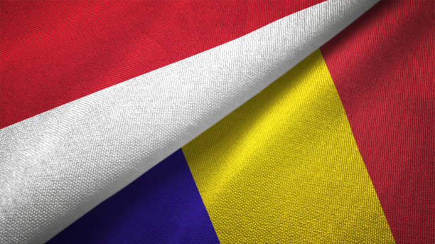 istock Romania and Indonesia two flags together textile cloth fabric texture 1093216898