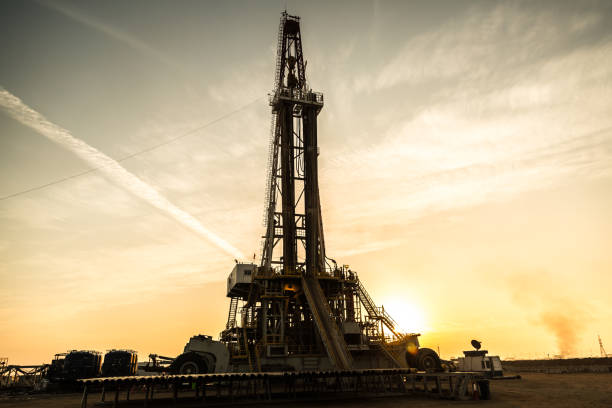istock Oil drilling rig at sunset 1093217020