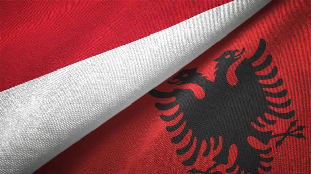 istock Albania and Indonesia two flags together textile cloth fabric texture 1093217190
