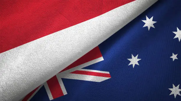 Photo of Australia and Indonesia two flags together textile cloth fabric texture