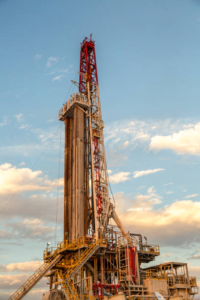 istock Oil drilling rig at sunset 1093217454