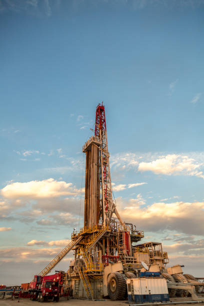 istock Oil drilling rig at sunset 1093217462