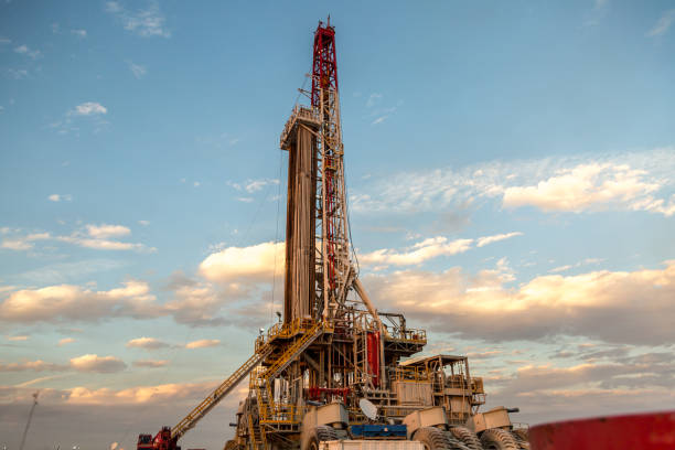 istock Oil drilling rig at sunset 1093217550