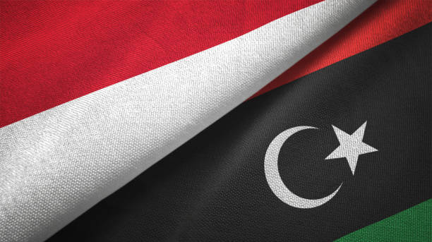 istock Libya and Indonesia two flags together textile cloth fabric texture 1093217786