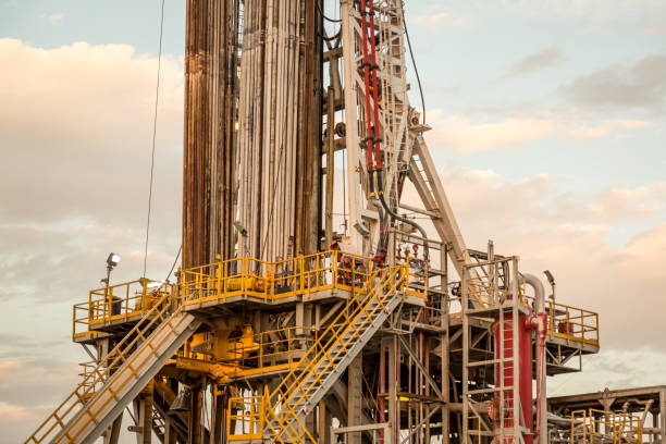 istock Oil drilling rig at sunset 1093217818