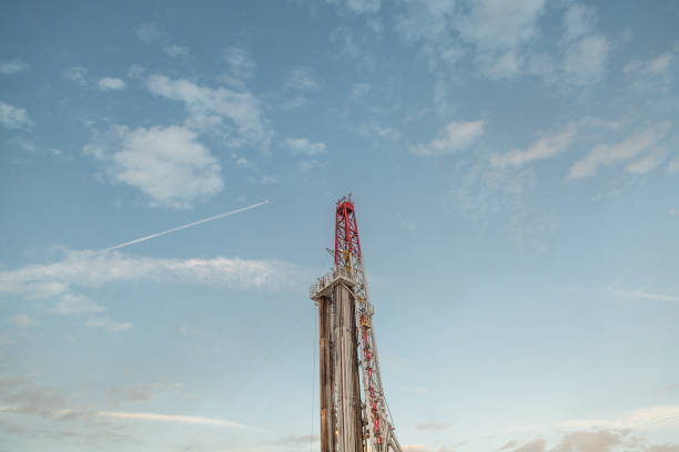 istock Oil drilling rig at sunset 1093217828