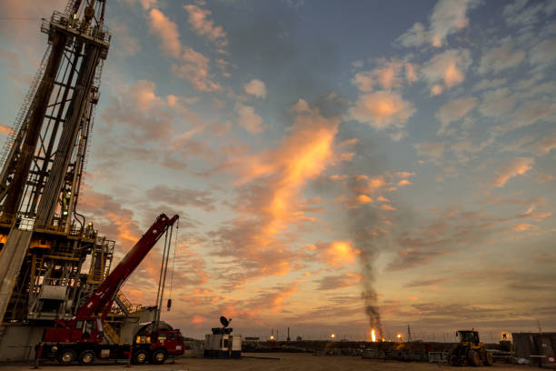 istock Oil drilling rig at sunset 1093219876