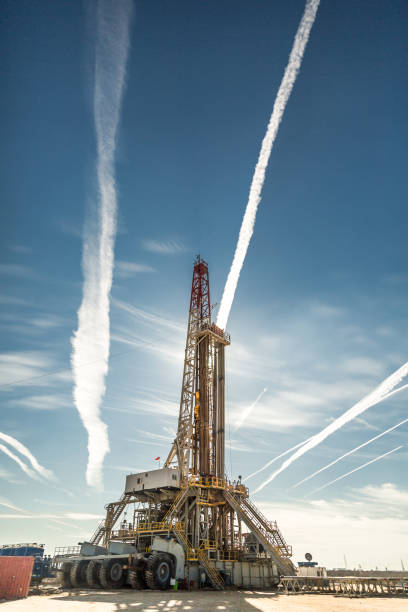 istock Oil drilling rig at sunset 1093220360