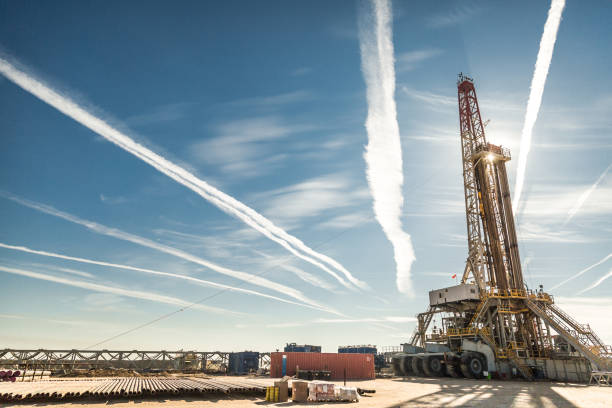 istock Oil drilling rig at sunset 1093220552
