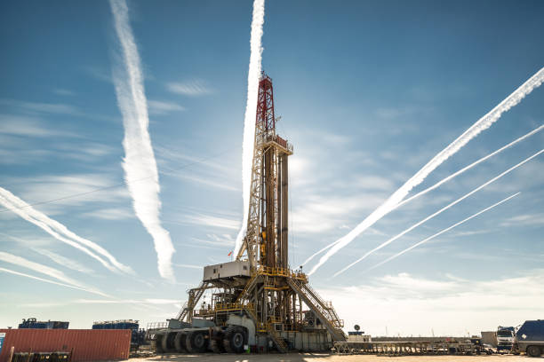 istock Oil drilling rig at sunset 1093221894