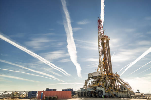 Oil drilling rig at sunset