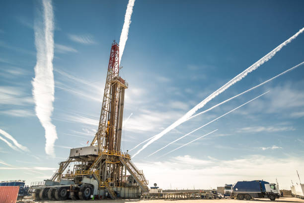 istock Oil drilling rig at sunset 1093221992