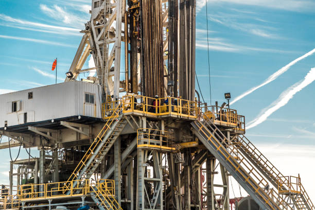 istock Oil drilling rig at sunset 1093222736