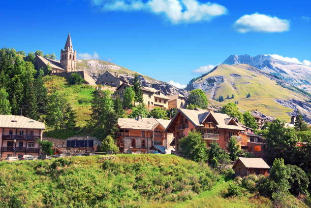 mountain village of huez en oisans. - france european alps landscape meadow imagens e fotografias de stock