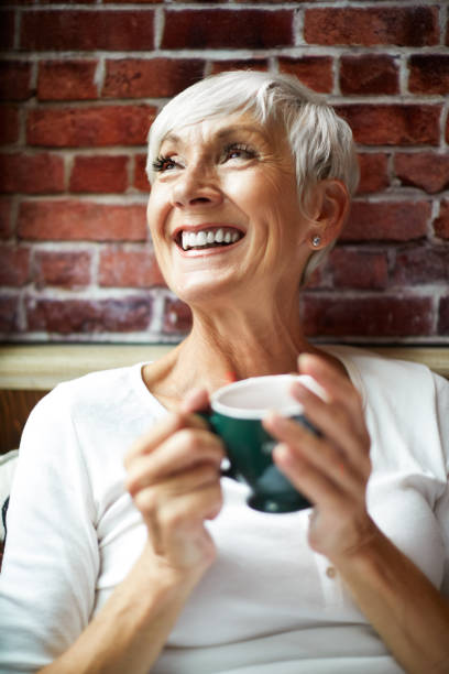 istock Lovely elderly woman fondly remembering while drinking a hot drink from a cup 1093224616