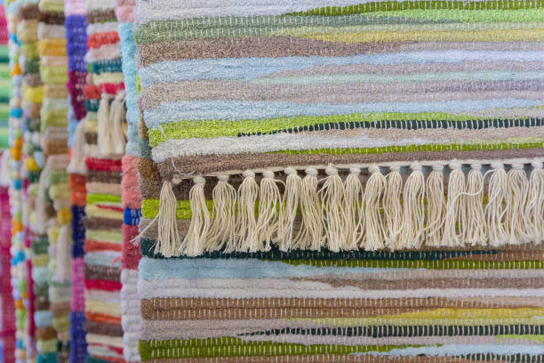 istock Beautiful multi-colored carpets hanging in a row at the bazaar 1093227128