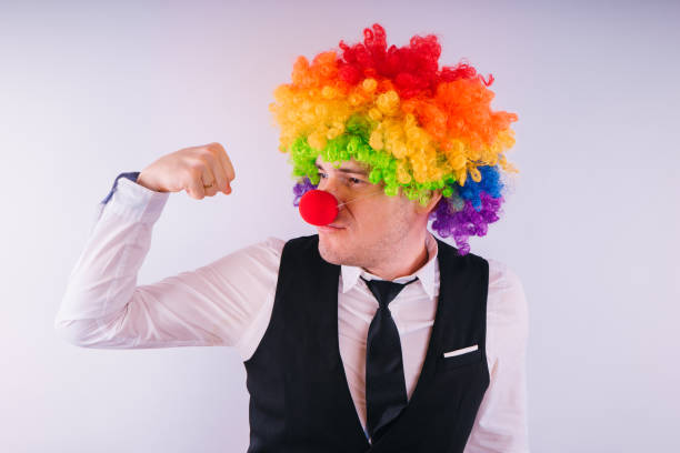 istock Office worker in clown wig 1093227894