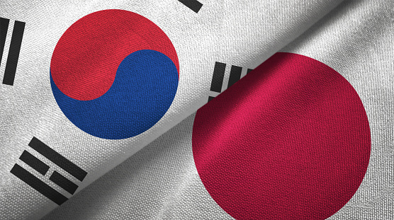 Japón y Corea del sur dos banderas juntas textil tela textura de la tela photo