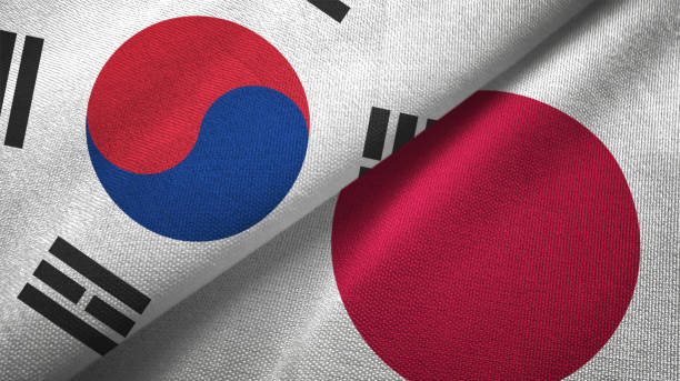 japón y corea del sur dos banderas juntas textil tela textura de la tela - corea del sur fotografías e imágenes de stock