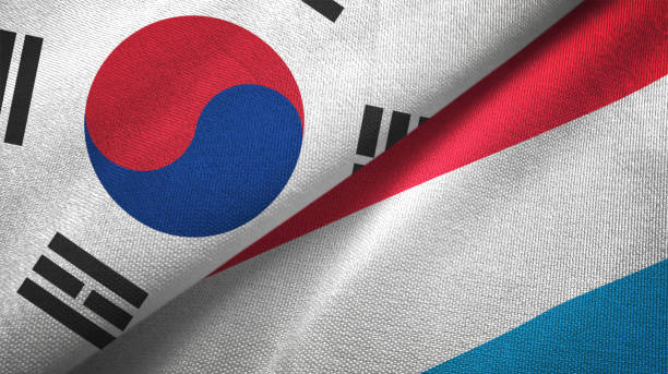 istock Luxembourg and South Korea two flags together textile cloth fabric texture 1093229330