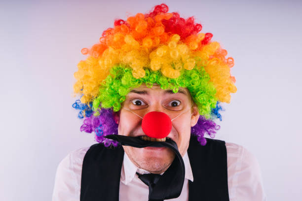 istock Office worker in clown wig 1093229416