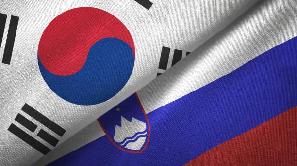 istock Slovenia and South Korea two flags together textile cloth fabric texture 1093229660