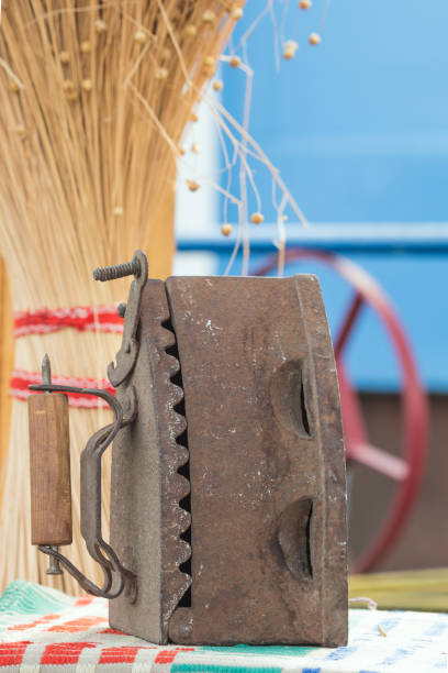 istock The most ancient metallic iron with wooden handle and covered with rust 1093230430