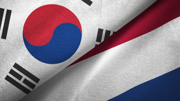 istock Netherlands and South Korea two flags together textile cloth fabric texture 1093232126