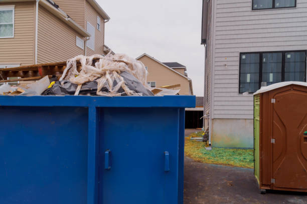 istock Portable restroom on a dumpsters being full with garbage new house under construction. 1093236354