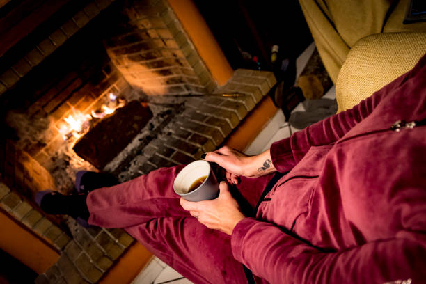 istock woman is warming in a fireplace 1093236632
