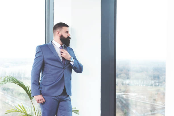 istock Fashionable manager posing with necktie 1093237850
