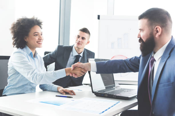 istock Businesspeople handshaking 1093237856