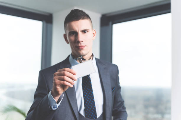 istock Young businessman holding identification card 1093237870