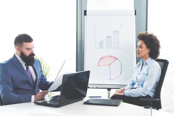 istock Businesspeople talking in the office 1093237888