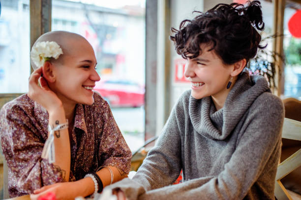 istock Two girls laughing at the bar. 1093240604