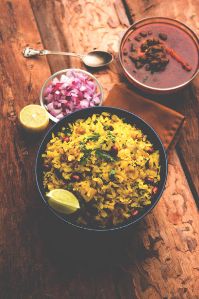 istock Aloo/Kanda Poha or Tarri Pohe with spicy chana masala/curry. selective focus 1093242598
