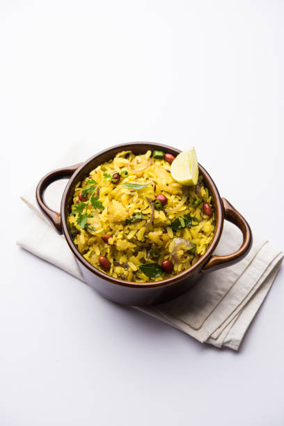 istock Aloo/Kanda Poha or Tarri Pohe with spicy chana masala/curry. selective focus 1093243068