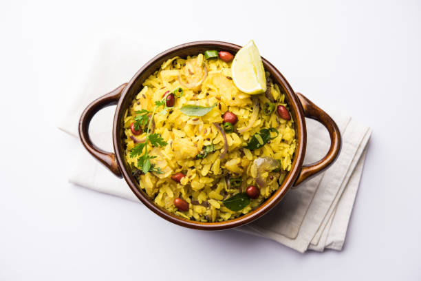 istock Aloo/Kanda Poha or Tarri Pohe with spicy chana masala/curry. selective focus 1093243532