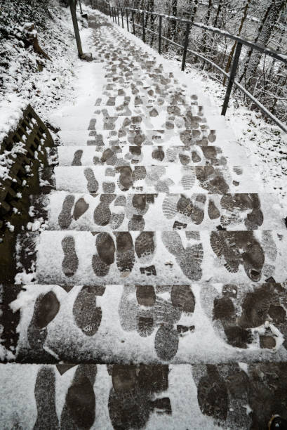istock long snow covered stairs in winter with foot steps and tracks 1093246338