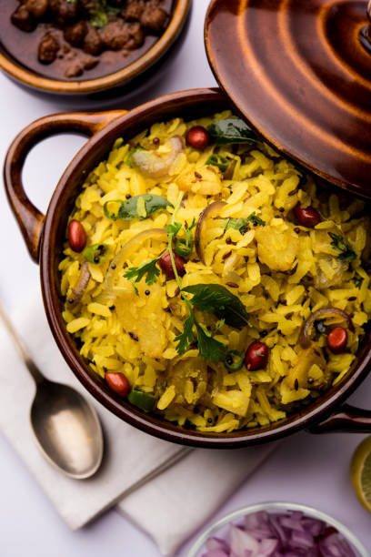 istock Aloo/Kanda Poha or Tarri Pohe with spicy chana masala/curry. selective focus 1093248048