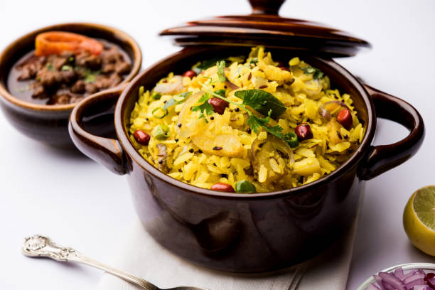 istock Aloo/Kanda Poha or Tarri Pohe with spicy chana masala/curry. selective focus 1093248320