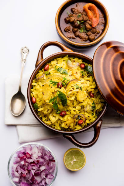 istock Aloo/Kanda Poha or Tarri Pohe with spicy chana masala/curry. selective focus 1093249466