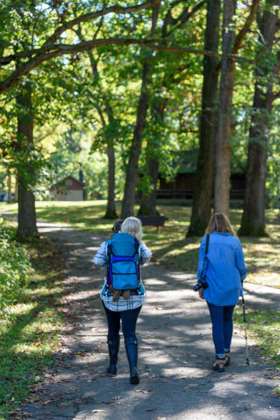 istock Mother and daughter walking and talking on path 1093249664