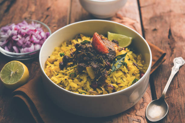 istock Aloo/Kanda Poha or Tarri Pohe with spicy chana masala/curry. selective focus 1093249908