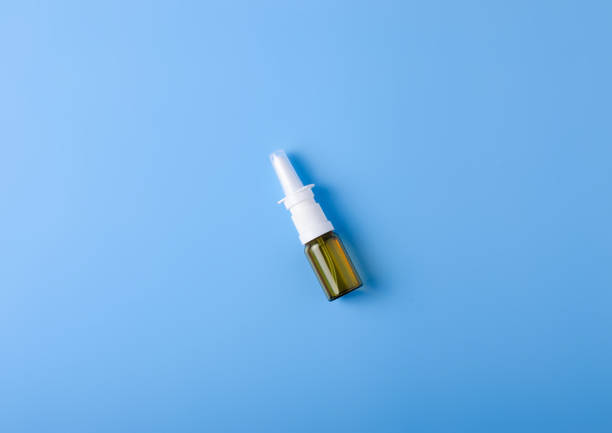 istock Spray for nose nasal on blue background 1093252630