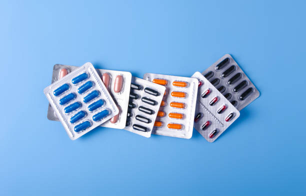 istock Blister pills capsule on blue background, top view 1093252688