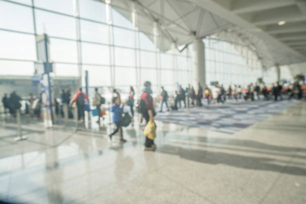 istock Passengers line up for boarding at a busy airport 1093253670