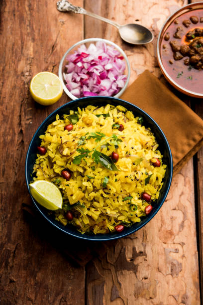 istock Aloo/Kanda Poha or Tarri Pohe with spicy chana masala/curry. selective focus 1093255948